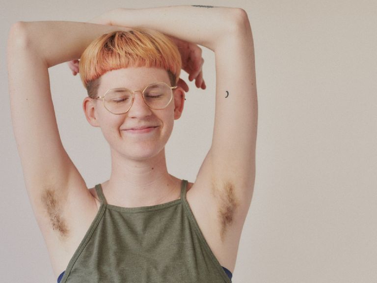 Non-binary Student smiling